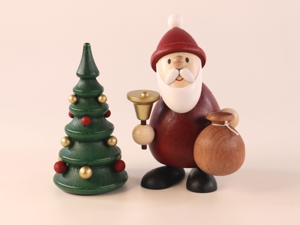 Ullrich Weihnachtsmann stehend mit Glocke und Weihnachttbaum